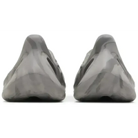 Rear view of adidas Yeezy Foam RNR MX Granite slip-ons in a grey marbled EVA foam with a contoured heel design.