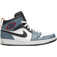 Air Jordan 1 Mid Fearless Facetasm in white leather with blue and navy overlays, orange heel tab, and red Wings logo.