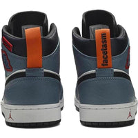 Air Jordan 1 Mid Fearless Facetasm with blue leather, orange heel tabs, and white midsoles featuring a red Jumpman logo.