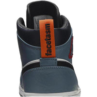 Rear view of Air Jordan 1 Mid Fearless Facetasm with blue leather, orange heel tab, and branded pull loop.
