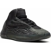 Adidas Yeezy QNTM Onyx sneaker with black Primeknit upper, suede toe cap, and a semi-translucent black midsole.