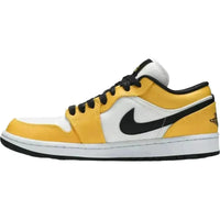 Women's Jordan 1 Low Laser Orange sneaker with white mesh, yellow leather overlays, and black Swoosh and lace details.