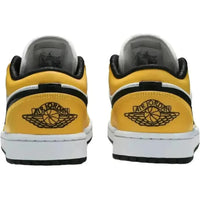 Rear view of women's Jordan 1 Low Laser Orange sneakers with black Wings logos and white midsoles.