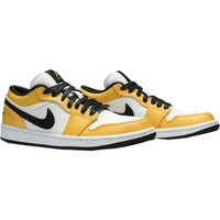 Women's Jordan 1 Low Laser Orange sneaker with white mesh, yellow leather overlays, and black Swoosh and lace details.