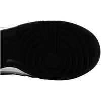 Black rubber outsole of a Nike Dunk Low sneaker featuring a classic circular pivot point traction pattern.