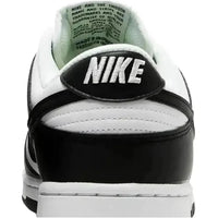 Back view of Nike Dunk Low Next Nature Panda women's sneaker with black and white leather and embroidered Nike heel logo.