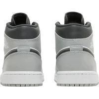 Back view of Jordan 1 Mid Light Smoke Grey sneakers featuring grey leather, black accents, and white midsoles.