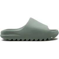 Adidas Yeezy Slide in Salt featuring a monochromatic light green foam construction with a textured, serrated outsole.