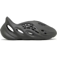 Adidas Yeezy Foam RNR Carbon in a sleek, one-piece molded foam design featuring strategic ventilation cutouts.